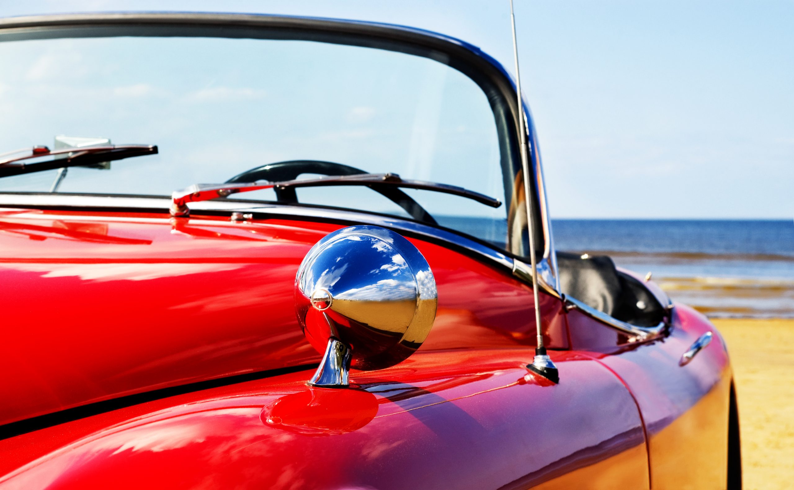 Classic Red Jaguar at Beach