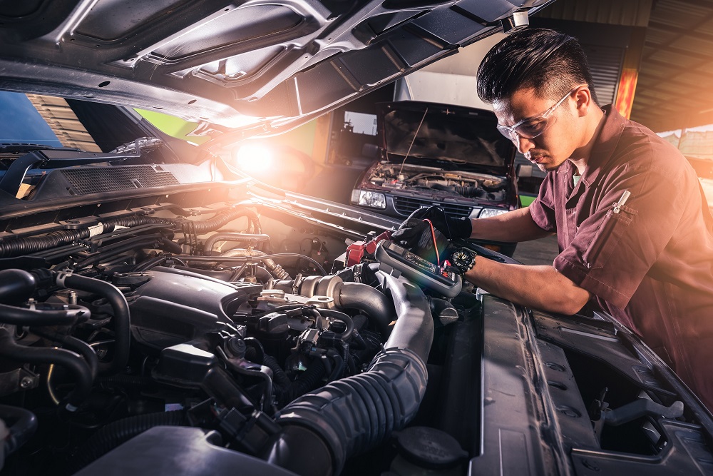 Auto Mechanic Checking Engine