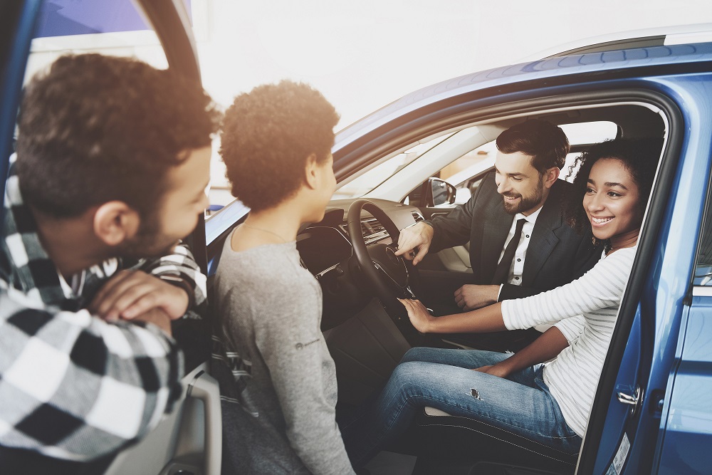 Couple Buying Car from Salesman