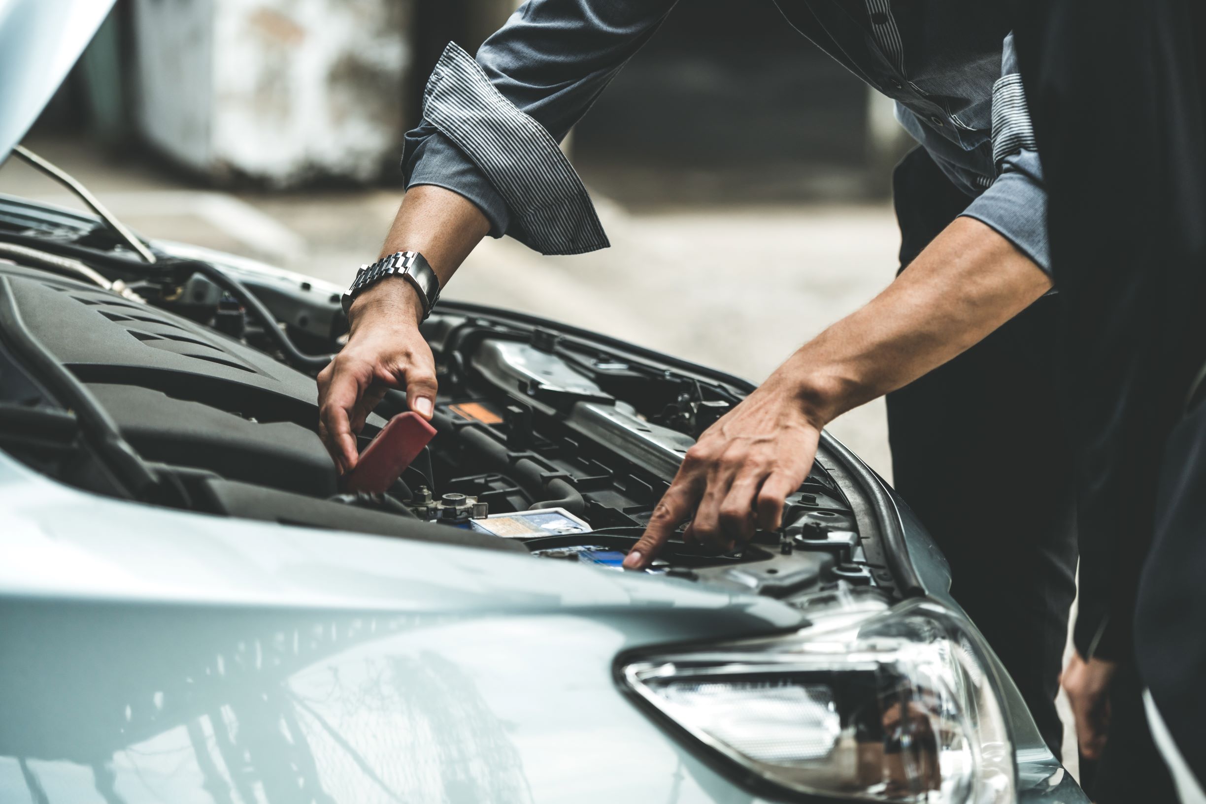 Man Looking Under the Hood of a Car in Houston, TX