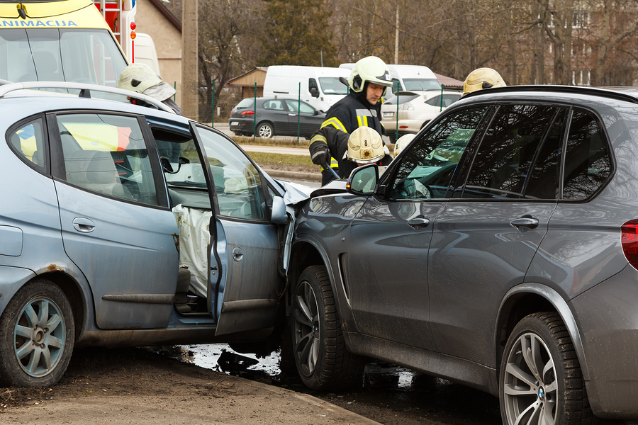 Collision of two cars near a park is shown