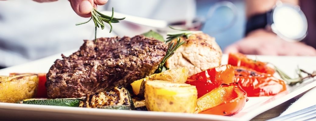 A steak served with vegetables